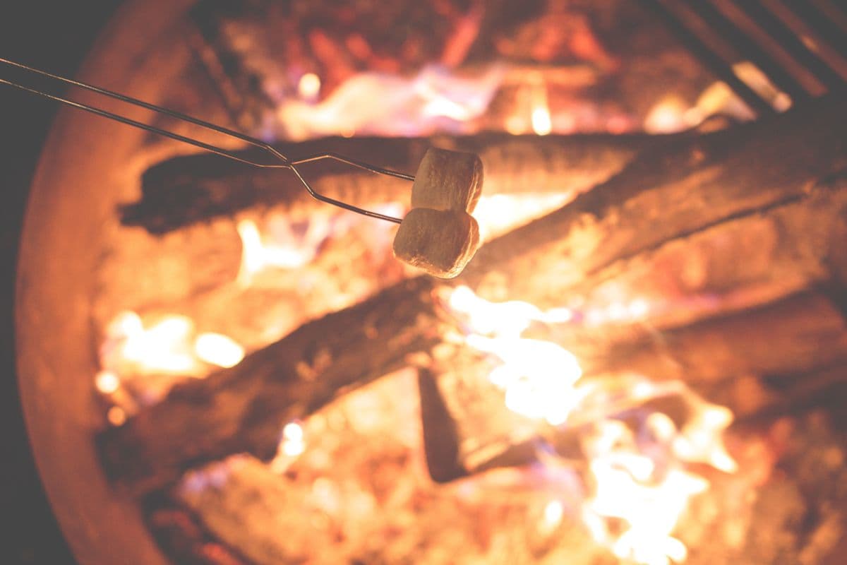 Marshmallows toasting over a campfire