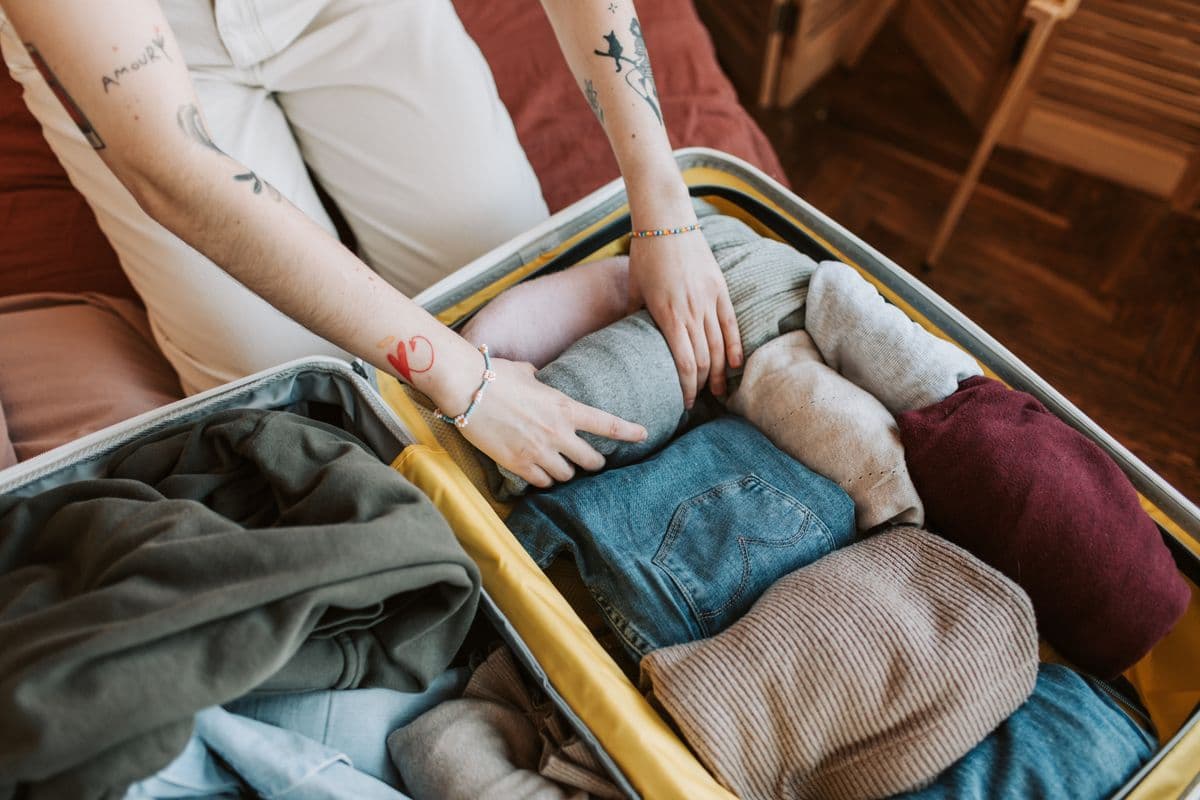Clothes packed neatly into a suitcase